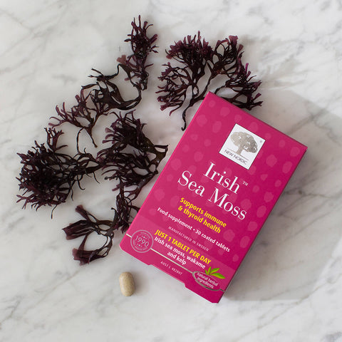 New Nordic Irish Sea Moss supplement with sea moss on a marble surface