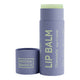 Noosa Basics Organic Lip Balm Chamomile 15g in a lilac cardboard tube with its cap lying beside it on a plain white background
