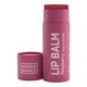 Noosa Basics Organic Lip Balm Raspberry 15g in a raspberry pink cardboard tube with its cap lying beside it on a plain white background