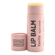 Noosa Basics Organic Lip Balm Vanilla 15g in a pale pink cardboard tube with its cap lying beside it, front view on a plain white background