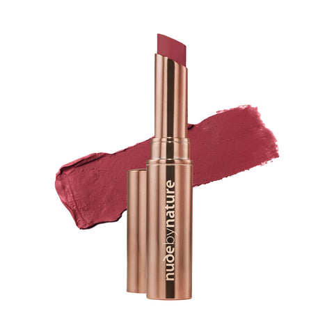 Nude By Nature Creamy Matte Lipstick 08 Cerise 2.75g, a rose gold tube beside a swatch of bright cerise pink lipstick on white