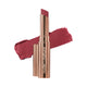 Nude By Nature Creamy Matte Lipstick 08 Cerise 2.75g, a rose gold tube beside a swatch of bright cerise pink lipstick on white