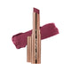 Nude By Nature Creamy Matte Lipstick Riberry, a rose gold tube beside a swatch of deep plum lipstick on white, clear product photo