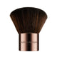Nude By Nature Kabuki Brush 07 with a dense dark bristle head and a bronze coloured handle, front view on a plain white background