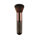 Nude By Nature Mineral Brush 11 with a round dark bristle head and a slim bronze handle, front view on a plain white background