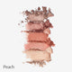 Stack of peach-colored makeup powders on a white background.