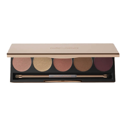 Makeup palette with shades of beige, brown, and gold on a white background.