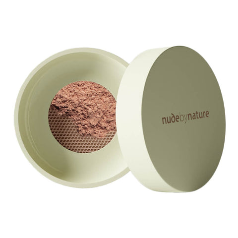 Green 10g container of Nude By Nature Natural Mineral Cover Blemish Control in shade light-medium. White background. 