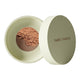 Green 10g container of Nude By Nature Natural Mineral Cover Blemish Control in shade medium. White background. 