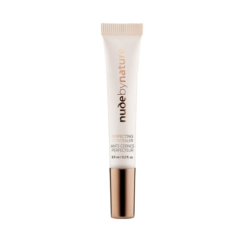 Nude By Nature Perfecting Concealer in a slim tube with a rose gold cap, standing upright, front view on a plain white background