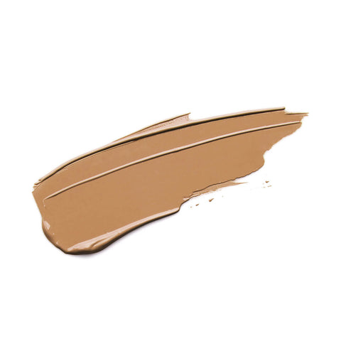 Nude By Nature Perfecting Concealer 07 Latte swatch, a smooth swipe of caramel tan concealer, close up on a plain white background