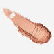 Nude-colored makeup swatch on a white background.
