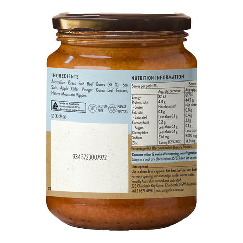 Nutra Organics Beef Bone Broth Concentrate Natural Beef 250g glass jar turned to show the left side of the blue label, with a nutrition table on white