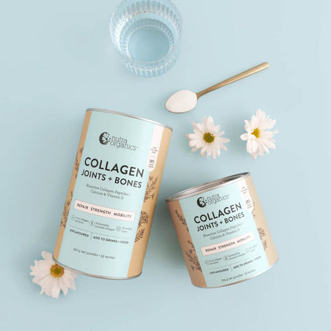 225g and 450g containers Nutra Organics Collagen Joints + Bones styled on a blue background with flowers and a glass of water.