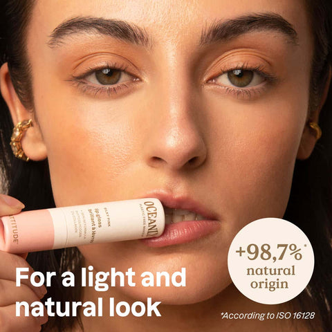 Oceanly Silky Pink Gift Set lifestyle shot of a woman with dark hair holding a stick makeup tube near her lips, with the words for a light look
