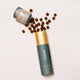 Ode Health Chaga Mushroom honey pearls spilling out of packet on a white background. 