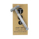 Parker Safety Razor 29L in a silver finish lying on its kraft cardboard box with a cut out on a plain white background, clear product photo