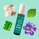 Plant Therapy Kids Itch Away essential oil roll-on with natural elements on a light green background