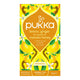 Pukka lemon, ginger, and manuka honey tea packaging on a white background.