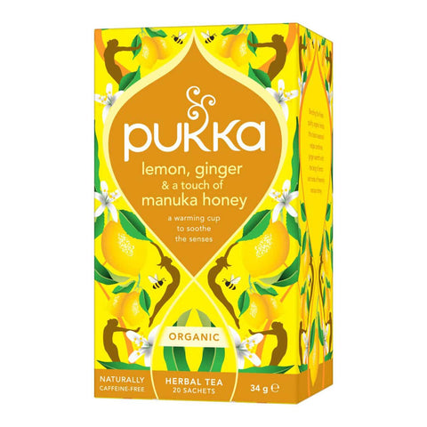 Pukka lemon, ginger, and manuka honey tea box on a white background