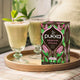 Pukka peppermint & licorice tea packaging with a drink on a tray
