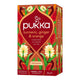 Pukka turmeric, ginger & orange tea box with floral design on a white background.