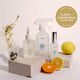 Three bottles of resparkle cleaning products with a lemon and orange on a white background, featuring the 'Clean + Conscious Awards 2024' gold winner badge.