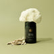Black container labeled 'Neural Nectar' with a cauliflower on a beige background