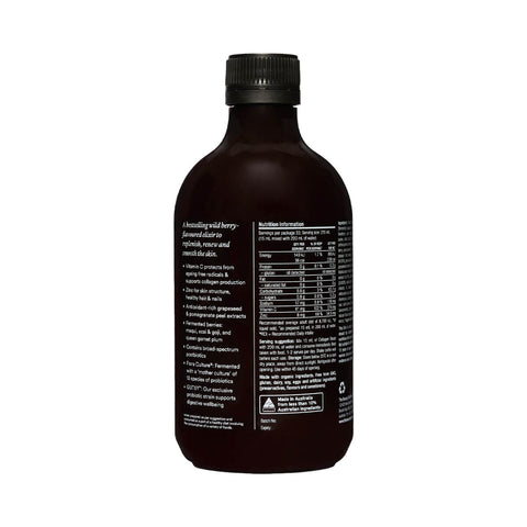 The Beauty Chef Collagen Boost 500ml dark glass bottle turned to show the back label with a nutrition table on a plain white background