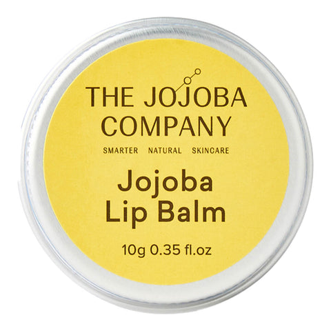 The Jojoba Company Jojoba Lip Balm 10g round silver tin with a bright yellow lid and the Jojoba Company name, top view on a plain white background
