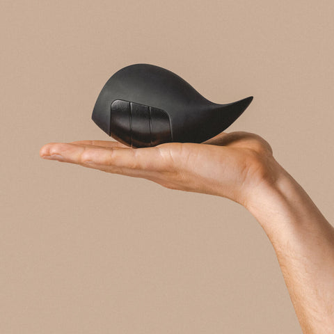 Hand holding The Natural Love Company Bergamot, a luxury penis masturbation cup.