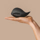 Hand holding The Natural Love Company Bergamot, a luxury penis masturbation cup.