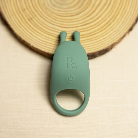 The Natural Love Company Cilantro, a rabbit eared cock ring, with a recycled ocean plastic core and buttery smooth sanitary grade silicone exterior, finished in a contemporary peacock blue. Designed for a fusion of pleasure for both partners during partnered sex.