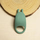 The Natural Love Company Cilantro, a rabbit eared cock ring, with a recycled ocean plastic core and buttery smooth sanitary grade silicone exterior, finished in a contemporary peacock blue. Designed for a fusion of pleasure for both partners during partnered sex.