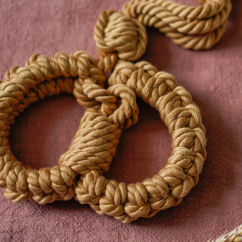 The Natural Love Company Kanuka Handcuffs, soft handcuffs with control cord.