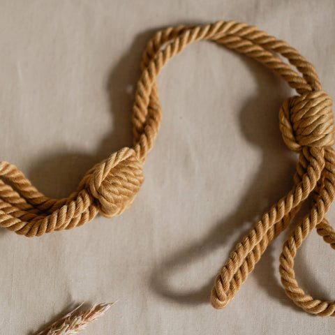 The Natural Love Company Kanuka Handcuffs, soft handcuffs with control cord.