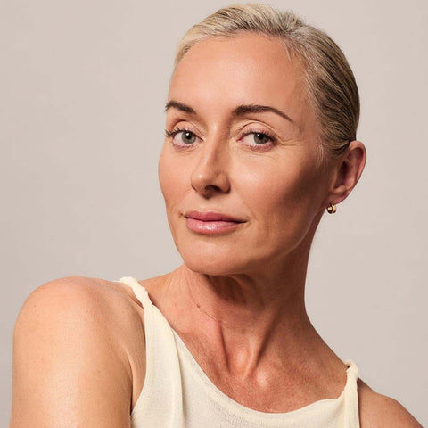Mature woman with beautiful subtle tan on her face.