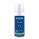 Weleda Men's 5 in 1 Multi-Action Serum in a blue pump bottle with a white pump, front view on a plain white background, clear product photo