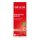 A 100ml bottle of Weleda Regenerating Body Oil in Pomegranate, featuring a red and white box with a small green organic seal.