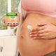 Pregnant belly with Welda Stretch Mark Body Butter 150ml application.