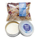 Bath salts and muscle rub in a tin with lid open. 