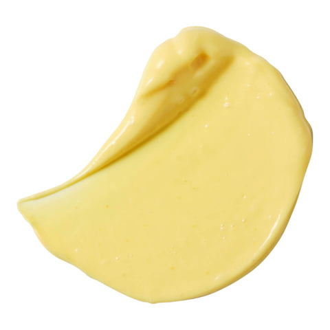 Wyuna Botanicals Golden Gem Face Cream 50ml swatch, a thick swipe of pale yellow cream, close up on a plain white background, clear product photo
